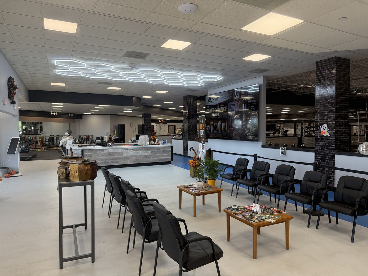 Lobby and front desk with the wellness gym behind it